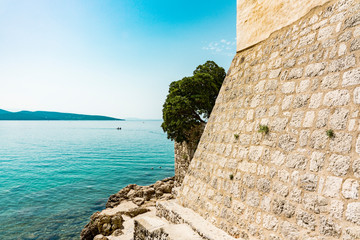 Fototapeta na wymiar city wall of Frankopan Castle in Krk Town, along the Adriatic Sea. Krk Island, Croatia