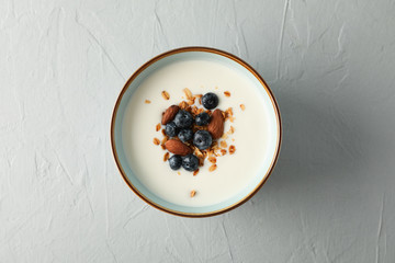 Bowl with parfaits dessert on white cement background