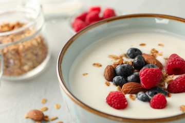 Flat lay composition with parfaits dessert and ingredients on white cement background