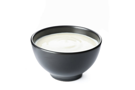 Bowl Of Sour Cream Yogurt Isolated On White Background