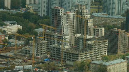 Fototapeta premium Moscow cityscape, a mixture of buildings with buildings under construction