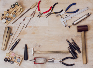 Tools set of jewellery. Jewelry workplace on wood background with copy space for text. Top view.