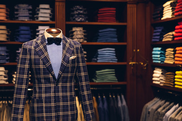 Men suit shop clothing store, dark background