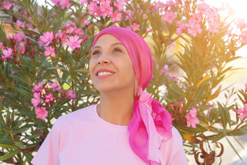 Woman with pink scarf on the head