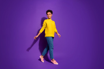 Full length body size view portrait of nice attractive charming lovely peaceful content wavy-haired lady walking isolated over bright vivid shine violet background