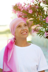 Woman with pink scarf on the head