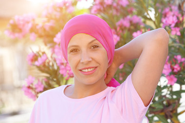 Woman with pink scarf on the head