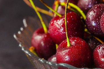 Close up of fresh cherry berries with water drops.