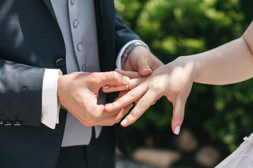 Obraz na płótnie Canvas A man wears a wedding ring for his wife