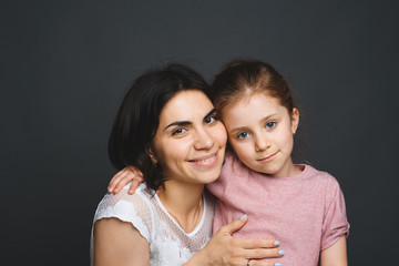 daughter hugging mother