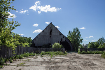 Fototapeta na wymiar Old dilapidated metal production hangar
