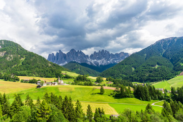 Fototapeta na wymiar Scenic view of Santa Maddalena village church. Dolomites, Val di Funes, Italy.