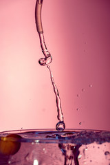 Water splash isolated on pink background, water bubble, detailed picture, natural elements.