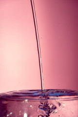 Water splash isolated on pink background, water bubble, detailed picture, natural elements.