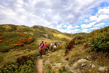 Horse riding in the Caucasus Mountains.