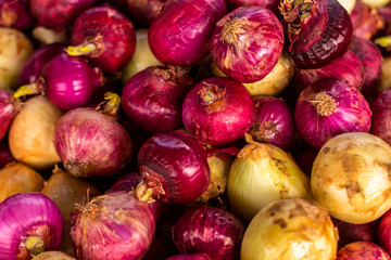Red onions in unpeeled. Fresh vegetables for cooking. Organic food.