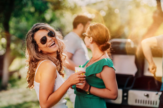 Portrait of smiling girl, happy woman enjoying sunday with friends at barbecue party