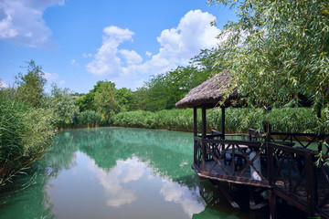 beautiful view of the gazebo that stands on the lake