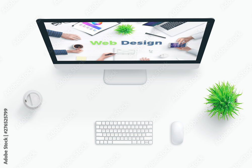 Fototapete Web design studio concept. Flat lay scene with computer display and web design text.