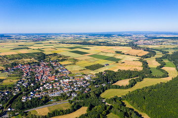 Aerial photograph, Agricultural area, Meadows, fields of cereals, villages, fields, forests. Wetterau, Hochtaunuskreis, Hesse, Germany - obrazy, fototapety, plakaty