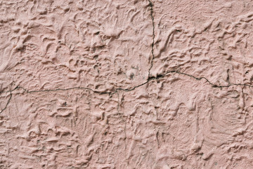 Background, texture of uneven brown cement wall, close-up