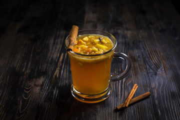 A cup of tea on a dark wooden table. Concept for menu.
