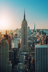 view of Manhattan skyline and skyscrapers at sunrise, New York © ManuPadilla