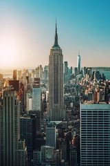 Photo sur Plexiglas Empire State Building vue sur les toits de Manhattan et les gratte-ciel au lever du soleil, New York