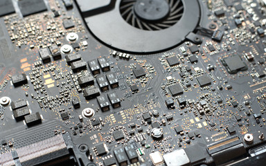 Electronic circuit board close up. Blurred background