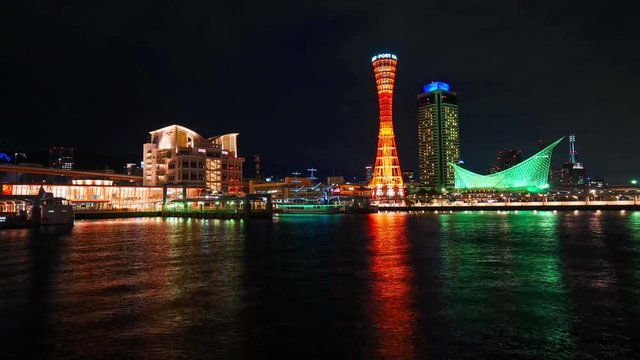 Night Time lapse from sea side on Kobe Port Tower and city, Japan