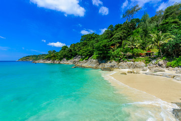 Fototapeta na wymiar Freedom beach, Phuket, Thailand - Tropical island with white paradise sand beach and turquoise clear water and granite stones