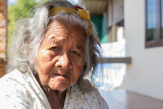 Close-up  senior elderly women. face of sad alone at home