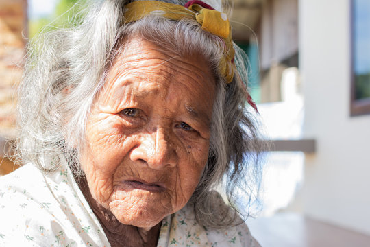 Close-up  senior elderly women. face of sad alone at home