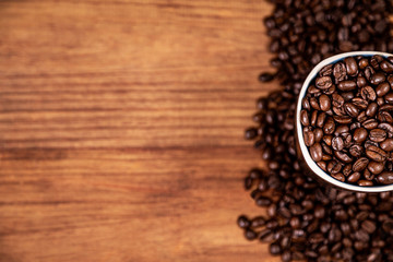 coffee beans mug and wood background.