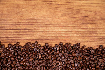coffee beans and wood background.