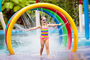 Kids at aqua park. Child in swimming pool.