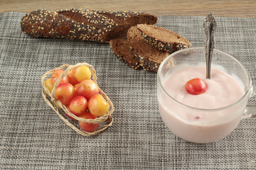 cherry yogurt fresh sweet cherries and baguette on table