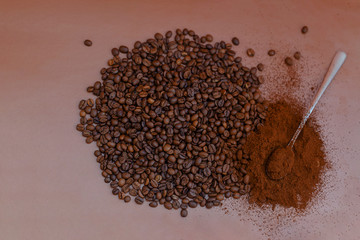 Coffee beans and ground coffee on the table are prepared for morning coffee.