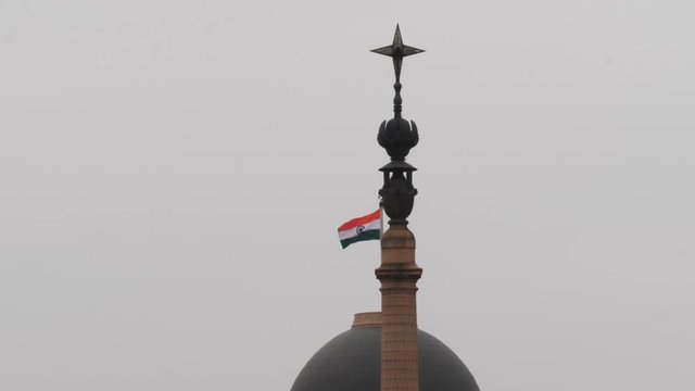 a close up of the flag on top of the indian president's house in new delhi, india- 4K 60p