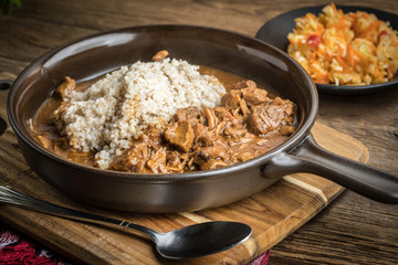 Barley groats with stewed meat.