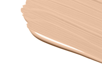 Liquid foundation texture smear isolated on white background. Makeup product swatch. Nude beige...