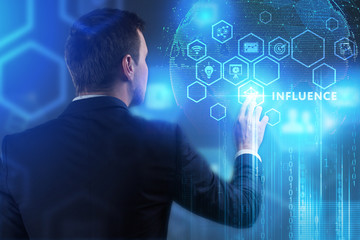 The concept of business, technology, the Internet and the network. A young entrepreneur working on a virtual screen of the future and sees the inscription: Influence