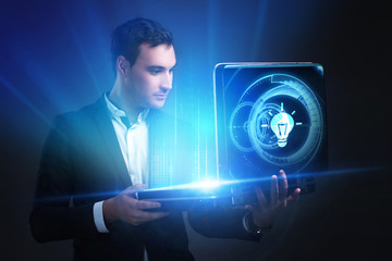The concept of business, technology, the Internet and the network. A young entrepreneur working on...