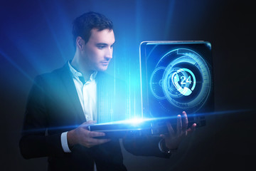 The concept of business, technology, the Internet and the network. A young entrepreneur working on...