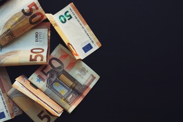 Banknotes on a black background.