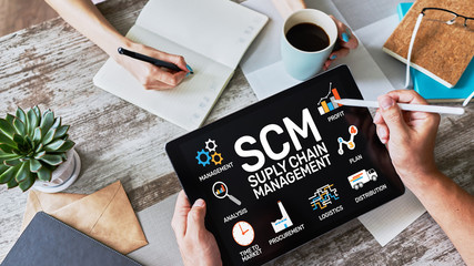 SCM - Supply Chain Management and business strategy concept on the screen.