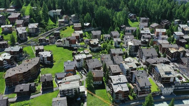 Aerial view of Zermatt, town under famous mountain Matterhorn, turn of spring and summer - landscapes of Swiss Alps from above, Switzerland, Europe