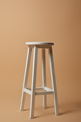 high white chair on beige background
