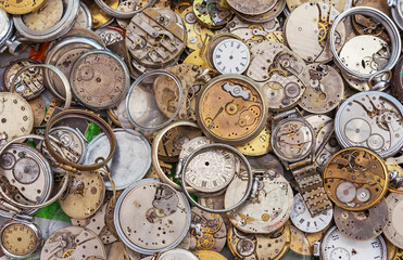 Antique watches of different shapes and sizes. Background with vintage clock.