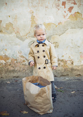 shopping. childrens day. small kid with shopping bag. happy childhood. holiday shopping. ready for date. little boy in vintage coat. Beauty. retro style. vintage trendy look. stylish child after shop